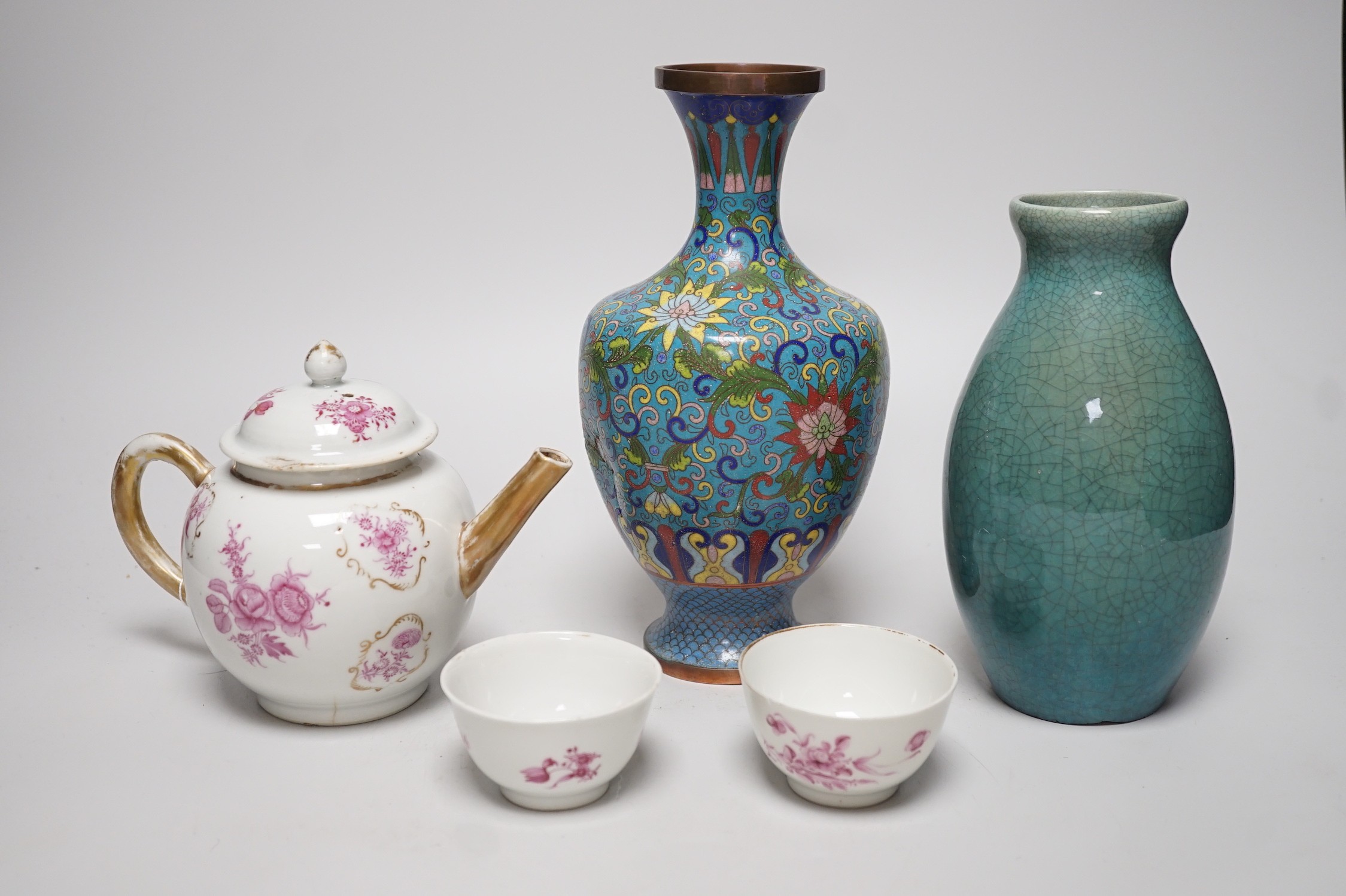 A selection of Oriental ceramics, to include a Chinese pink enamelled export teapot and matching tea bowls, a cloisonné blue ground vase, and a blue Japanese crackle glaze, (5). Tallest 23cm